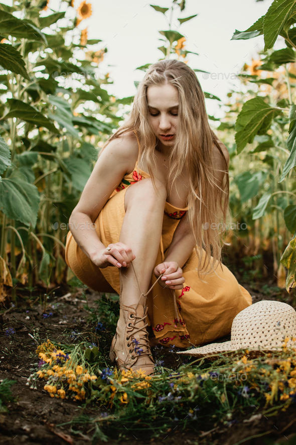 Summer outfit, Summer fashion, natural beauty. Outdoor candid portrait  Young blonde woman n ristic Stock Photo by IrynaKhabliuk