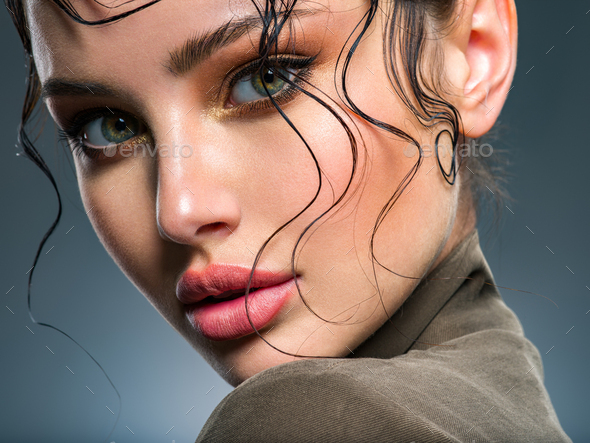 Beautiful woman Face with a bang. Model looking at camera. Sexy woman looks  at camera. Stock Photo by valuavitaly