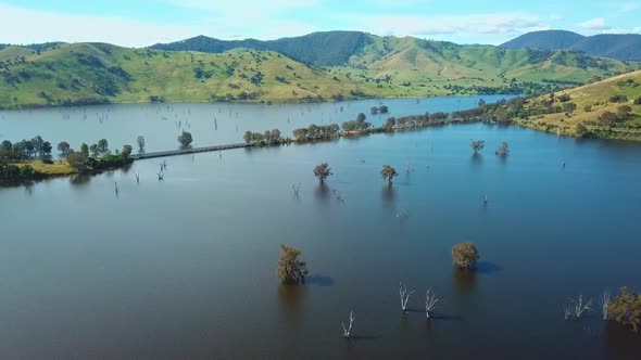 Aerial view of the Murray Valley Highway crossing the swollen floodplains of the Mitta Mitta River a alt
