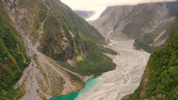 Aerial view of scenic Fox Glacier at the mountain range, New Zealand. alt