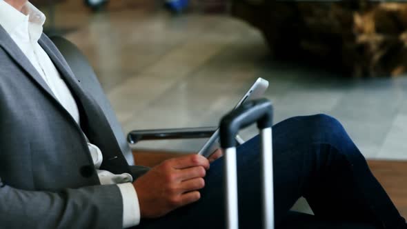 Businessman using digital tablet alt