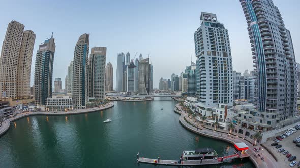 Beautiful Aerial Top View Day to Night Transition Timelapse of Dubai Marina Canal alt