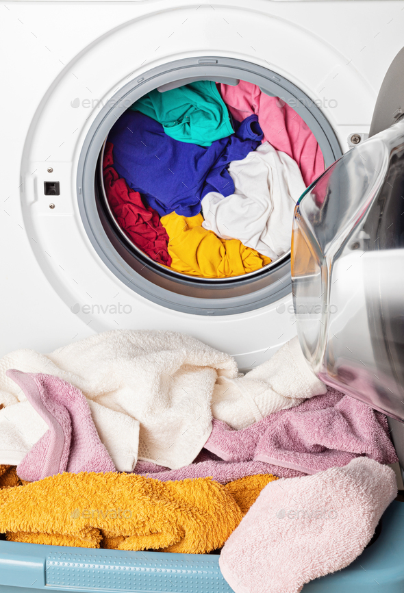 Washing or drying machine loaded with the laundry. Washing, spring cleaning idea