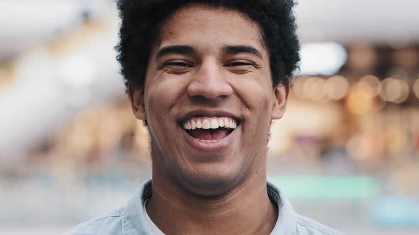 African American 30s Man Looking at Camera Having Wide Sincere Toothy Smile Dental Concept Laughing alt