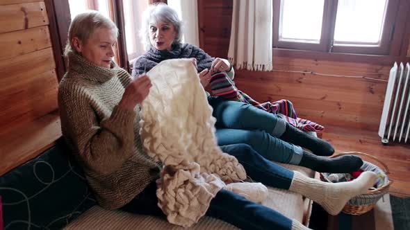 Grown Women Sit Chatting and Knitting and Laughing