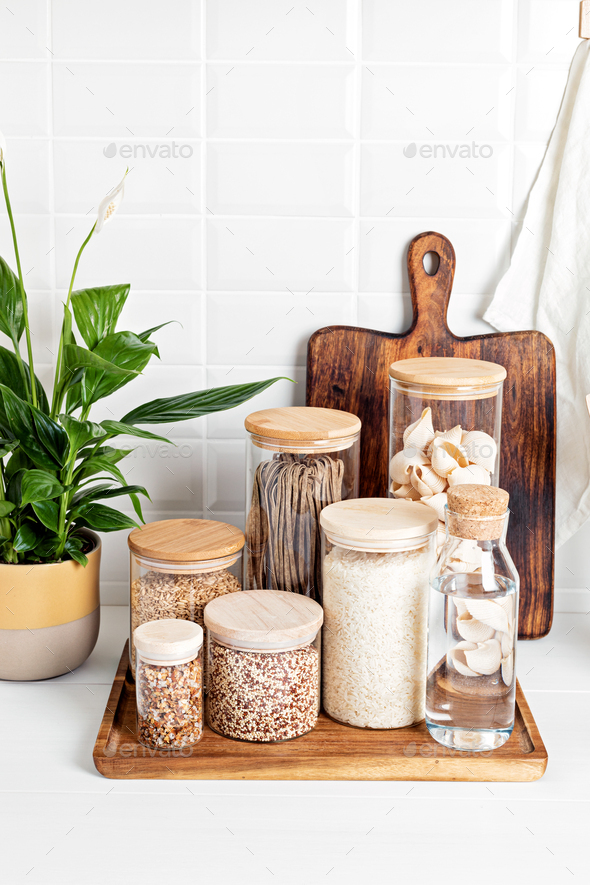 Organizing zero waste storage in kitchen. Pasta and cereals in reusable  glass containers in kitchen Stock Photo by OksaLy