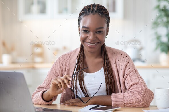 Successful Freelancer. Happy Black Lady Sitting At Desk With Computer At Home