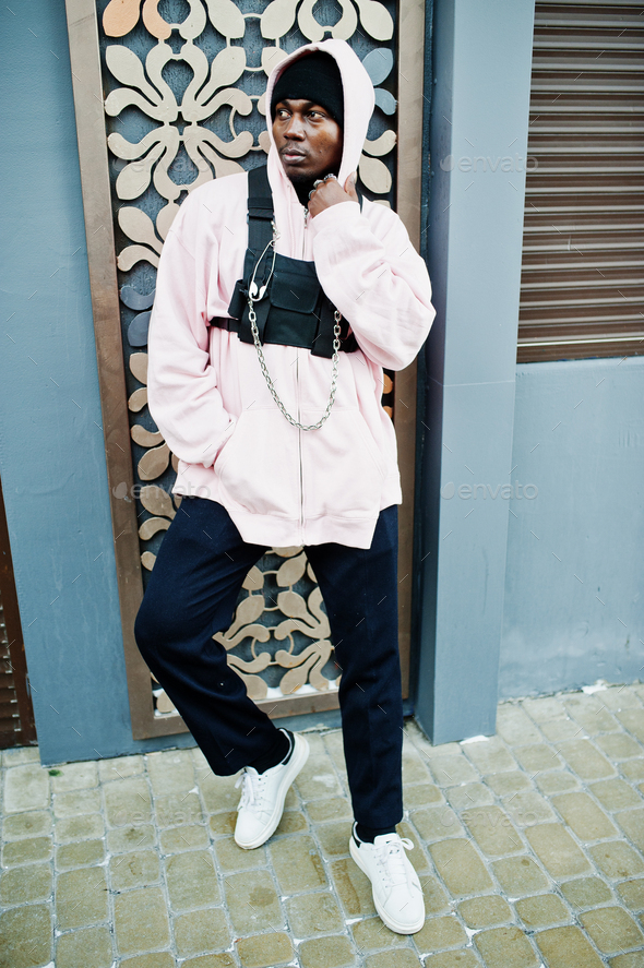 Stylish urban style african american man in pink hoodie