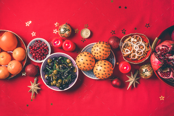 Festive family Christmas dinner. Vegan Christmas appetizers, olive, orange, fruits, vegetable salads