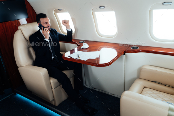 Business man flying on private jet