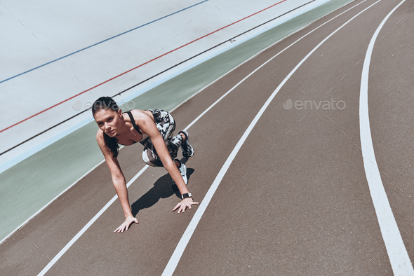Pushing herself to the limit.  - Stock Photo - Images