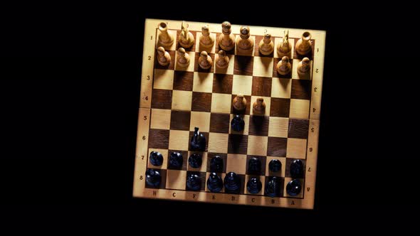 Old chess board with figures from the Soviet Union era on a black background