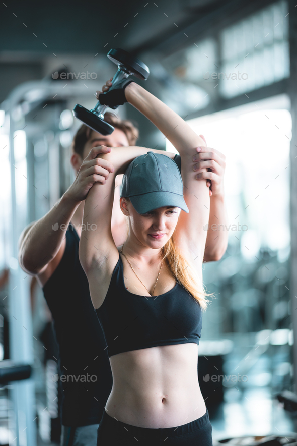 strong man exercising in the sport gym, workout exercise training in fitness  for body strong Stock Photo by ckstockphoto