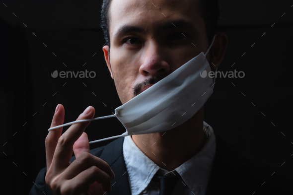 Businessman in suit wearing a face mask, People pay attention to the virus