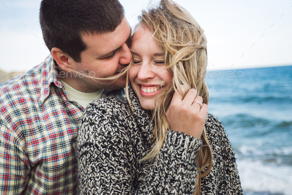 True emotions of happy loving couple. Close up portrait of laughing ...