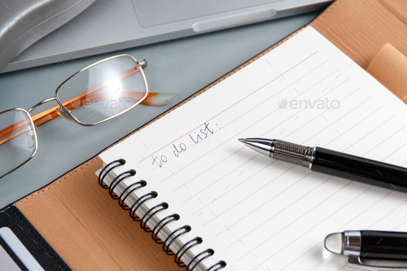 Opened agenda with handwritten TO DO LIST on a grey close up Stock ...