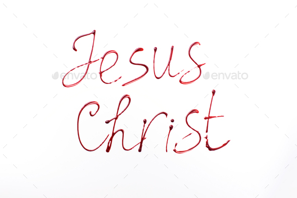 Name Jesus Christ written with blood isolated on white background. Top view. Palm Sunday, Good