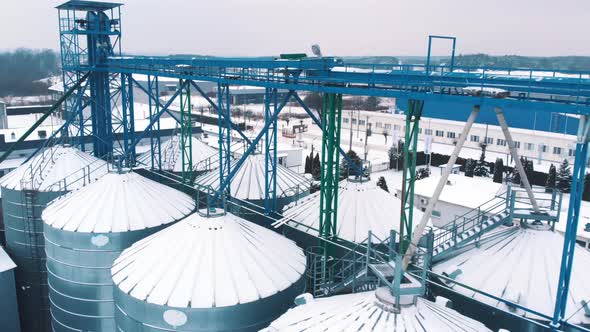 Aerial View of the Silo System Plant for Storage and Processing of Grain Covered in Snow in Warsaw alt