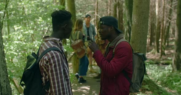 African American Friends Have a Chat at the Hiking Trail in the Forest Trekking and Tourism 60p