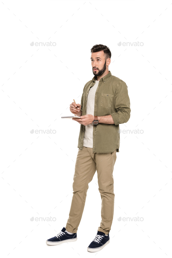 pensive man holding notebook and pen in hands isolated on white