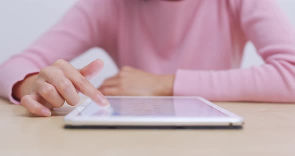 Woman use of digital tablet computer at home alt