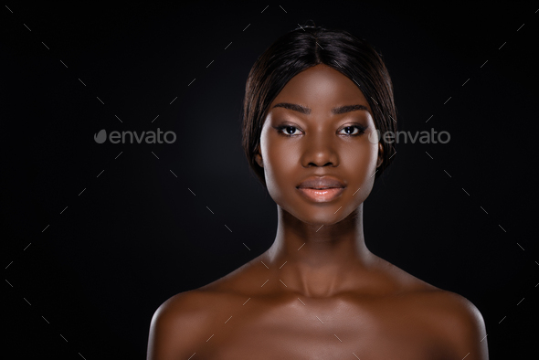 African American Naked Woman Looking At Camera Isolated On Black Stock