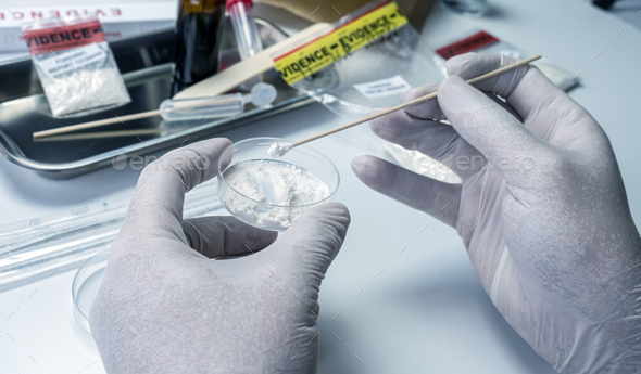police scientist making drug test in crime lab, conceptual image