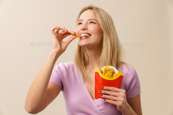 woman eating french fries