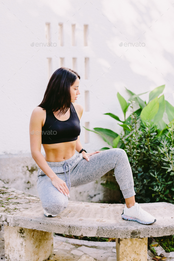 attractive fitness Female in sportswear outdoors. slim athletic Female  posing Stock Photo by avanti_photo