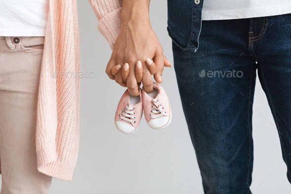 cute baby couple holding hands