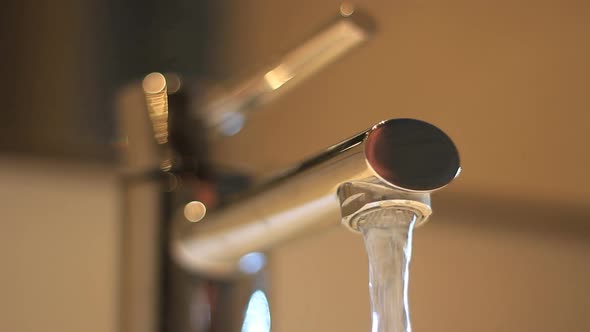 Faucet opening and closing close up alt