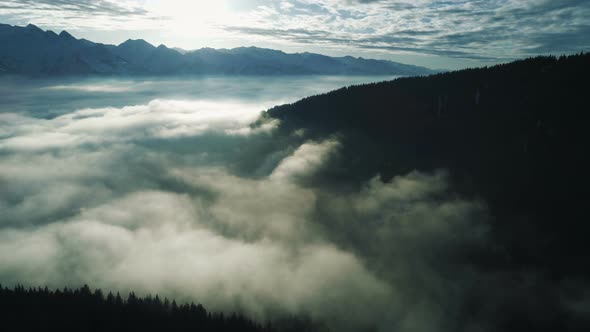 Foggy And Cloudy Valley In Mountains Landscape