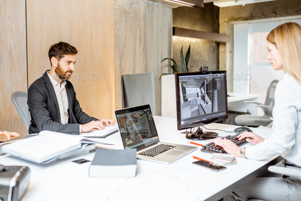 Designers working on the computers in the office - Stock Photo - Images