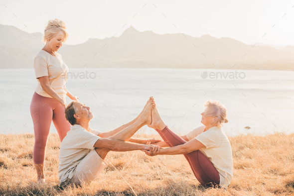 Fitness woman doing exercises in nature. Stock Photo by korneevamaha