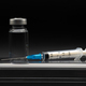 Vaccine with syringe on black background - PhotoDune Item for Sale