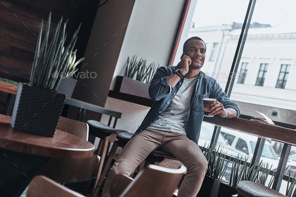 Planning weekend with his girlfriend. Stock Photo by gstockstudio