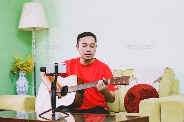 LIve streaming at home by musician - Stock Photo - Images