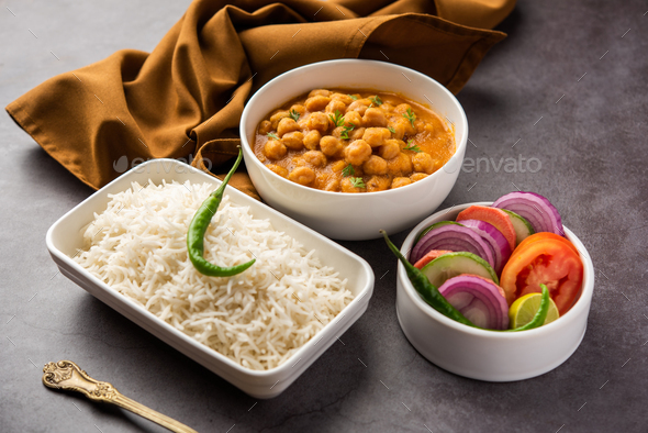 chole, Chickpea curry or chana masala with plain rice, Popular North ...