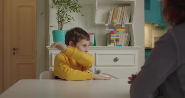 Child with Autism Playing Finger Game with Therapist alt