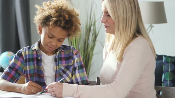 African Pupil From Primary School Is Learning Drawing in Class alt