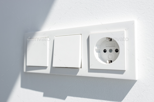 Modern White switch board with two switch and one european plug