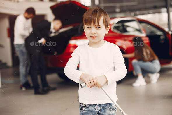 Family with little son in a car salon - Stock Photo - Images