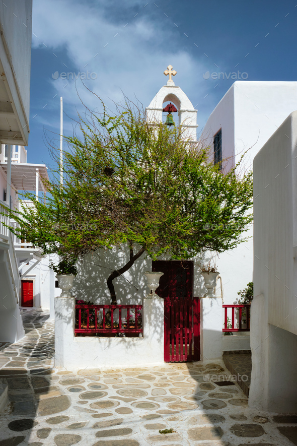 Greek Mykonos street on Mykonos island, Greece - Stock Photo - Images