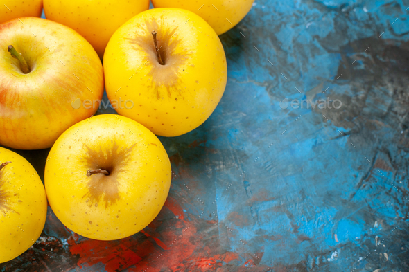 top view fresh sweet apples lined on blue background diet vitamine tasty health ripe photo mellow