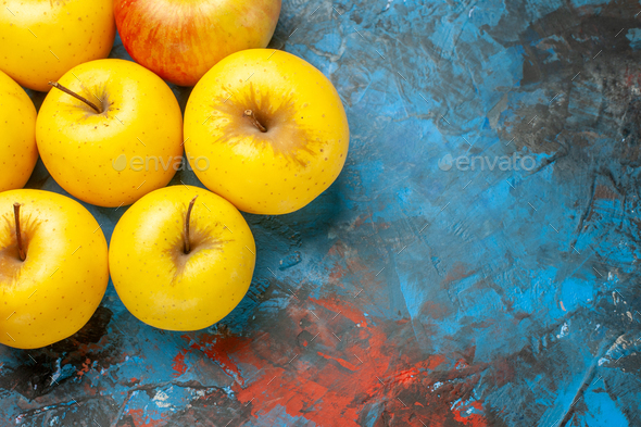 top view fresh sweet apples lined on blue background diet vitamine tasty health ripe photo mellow