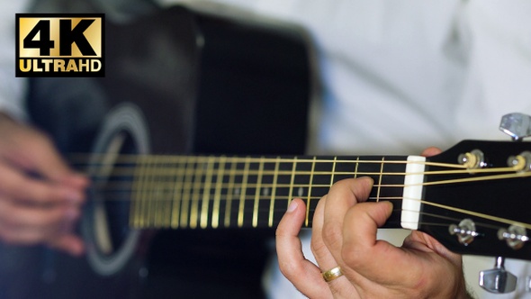 Man Playing Guitar Finger Picking 