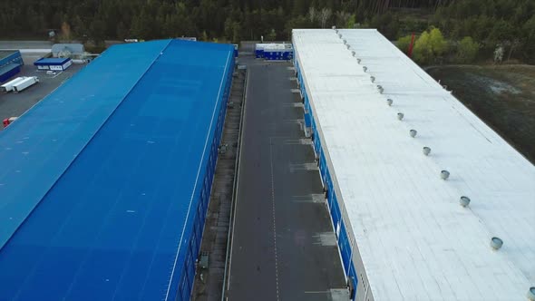 Aerial Top Down View of the Large Logistics Park with Warehouse Without Semi-trailers Trucks