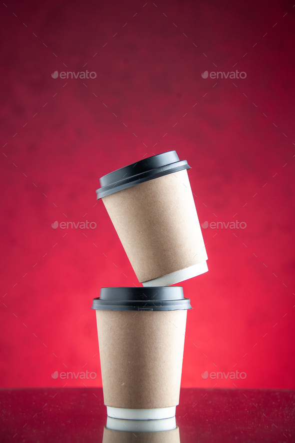 front view delivery coffee cups on a pink background service tea color photo drink