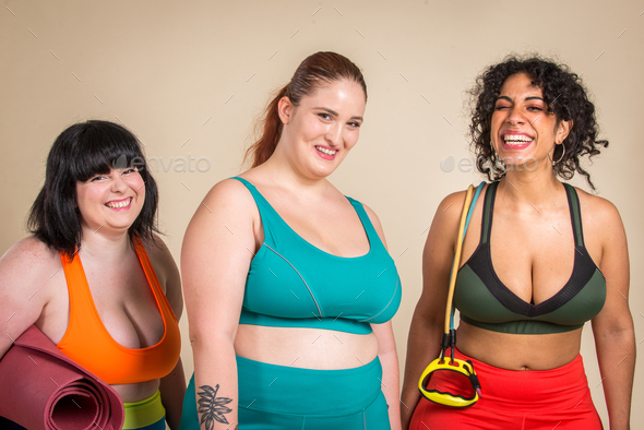 Plus size woman posing for body acceptance Stock Photo by oneinchpunchphotos