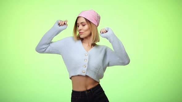 Woman in Casual Clothes Dancing on Color Background